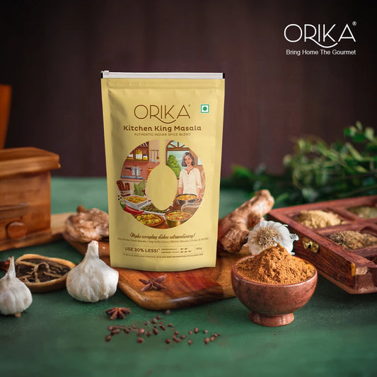 Orika Kitchen King Masala packaging with spices and ingredients on a green background